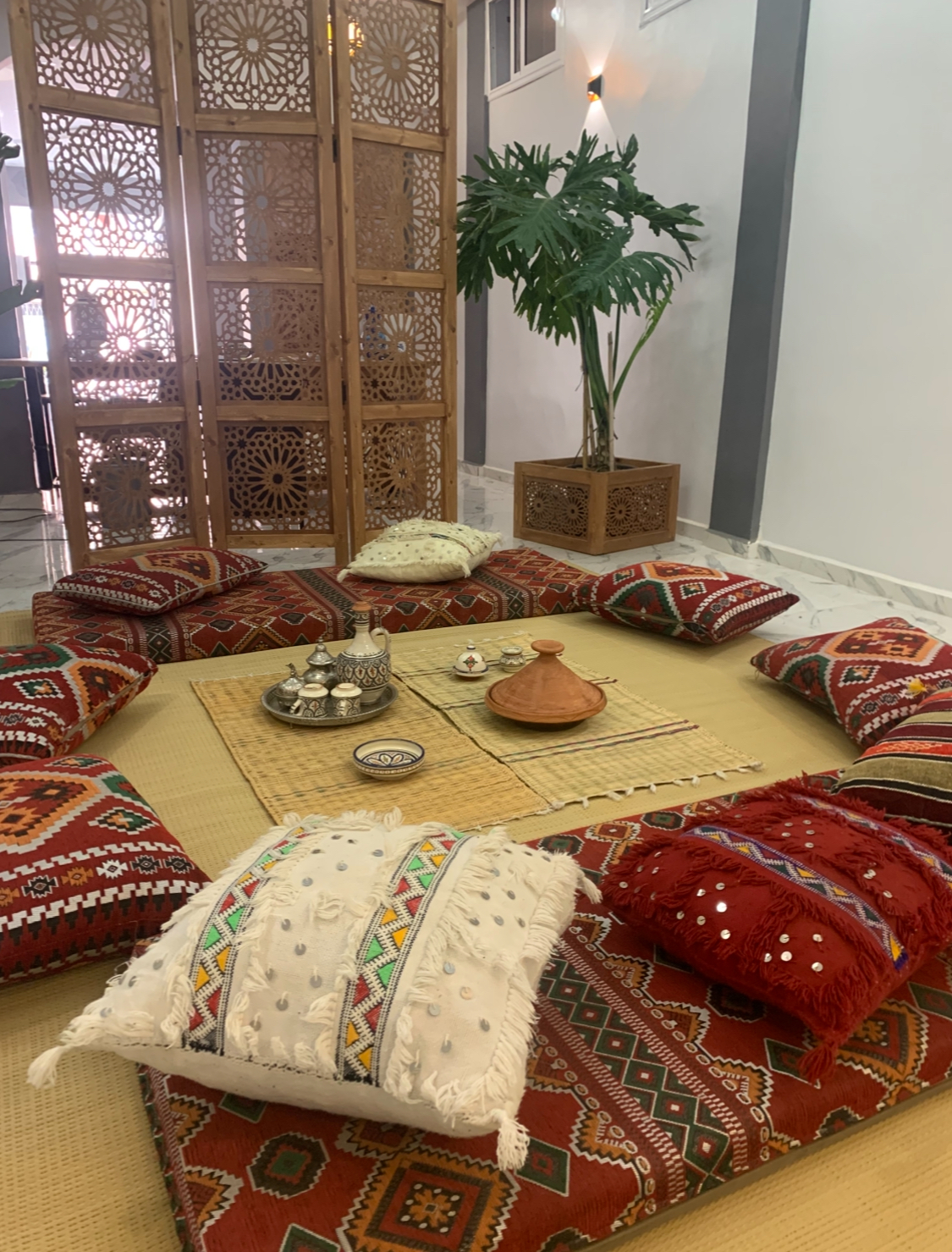 Traditional Moroccan lounge with kilim cushions and tea set