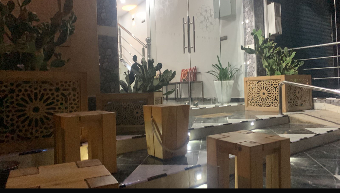 Moroccan tea on carved wood with cactus garden